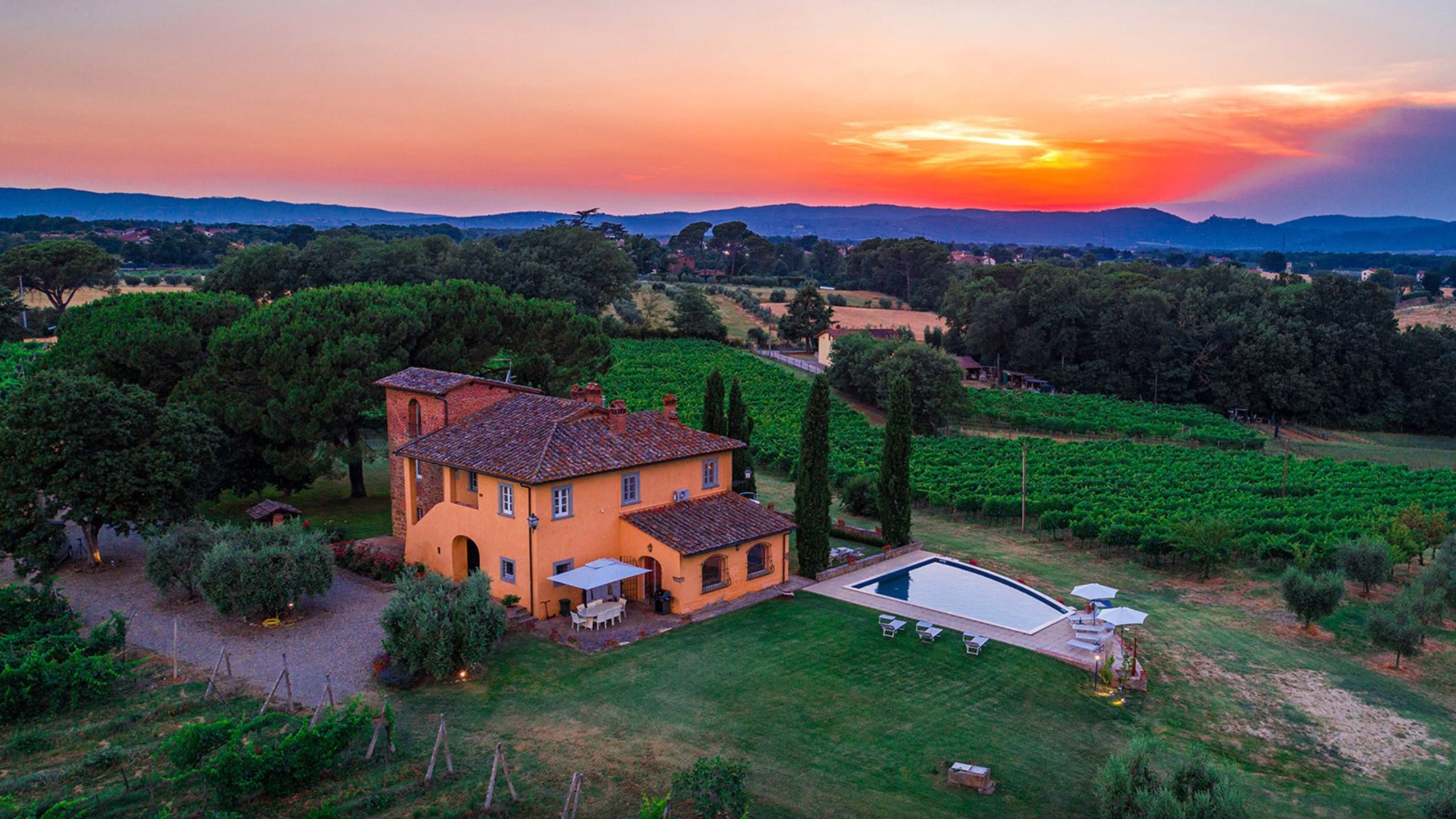 villa with garden and pool and sunset in italy